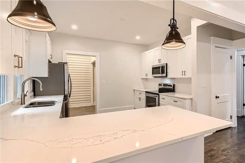 White kitchen before renovation.