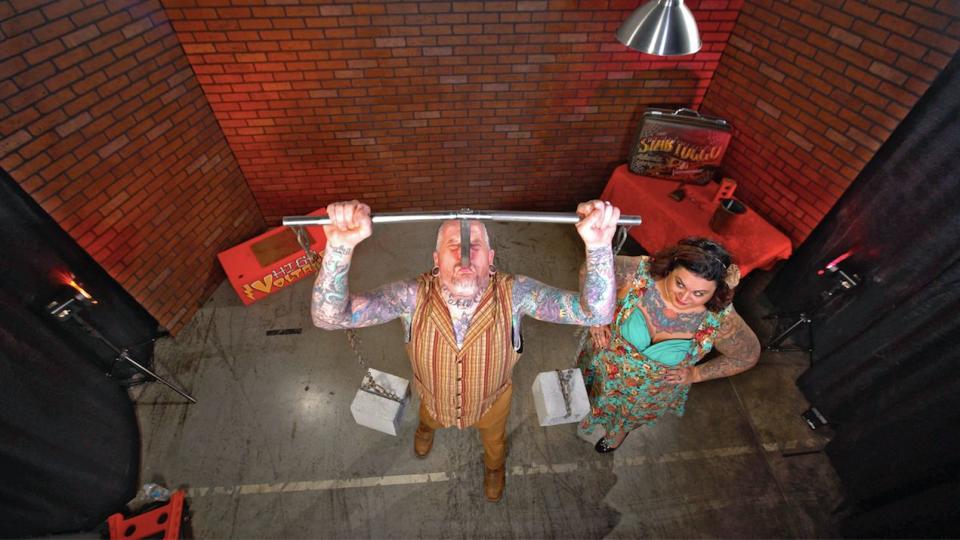 Chris and Elaina Steele, of Atlanta, have been performing classic sideshow stunts as vaudeville couple Captain and Maybelle for over 17 years. Everything from eye-socket weight-lifting to glass eating and human suspension. Captain holds the record for &ldquo;weighted sword swallowing&rdquo; -- a 17-inch blade with 84 pounds&nbsp;of weights attached.