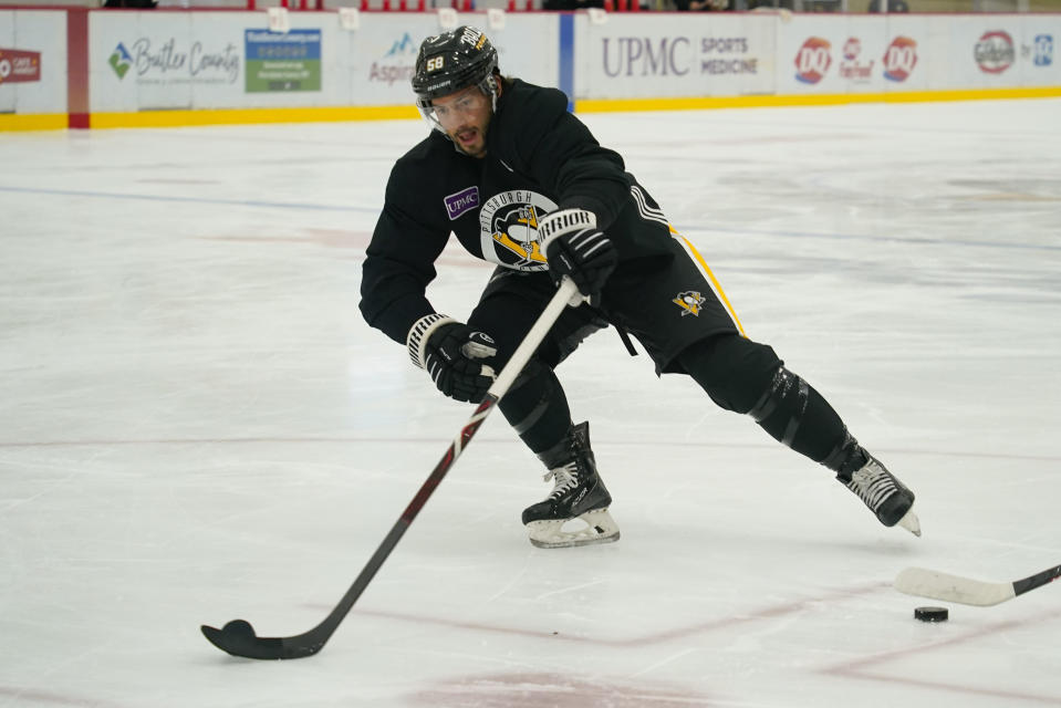 Pittsburgh Penguins' Kris Letang (58) goes through drills during an NHL hockey practice, Thursday, Sept. 22, 2022, in Cranberry Township, Butler County, Pa. (AP Photo/Keith Srakocic)