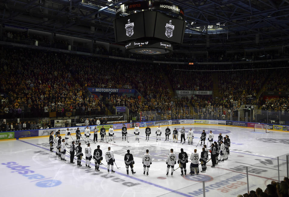 Players pay tribute before the Ice Hockey Adam Johnson memorial game between Nottingham Panthers and Manchester Storm at the Motorpoint Arena, Nottingham, England, Saturday, Nov. 18, 2023. The memorial game is held three weeks after Adam Johnson, 29, suffered a fatal cut to his neck during a game against Sheffield Steelers on Saturday, October 28, 2023. (AP Photo/Rui Vieira)