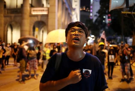 A protester attends a "Stand With Hong Kong, Power to the People Rally" at the Chater Garden, in Hong Kong