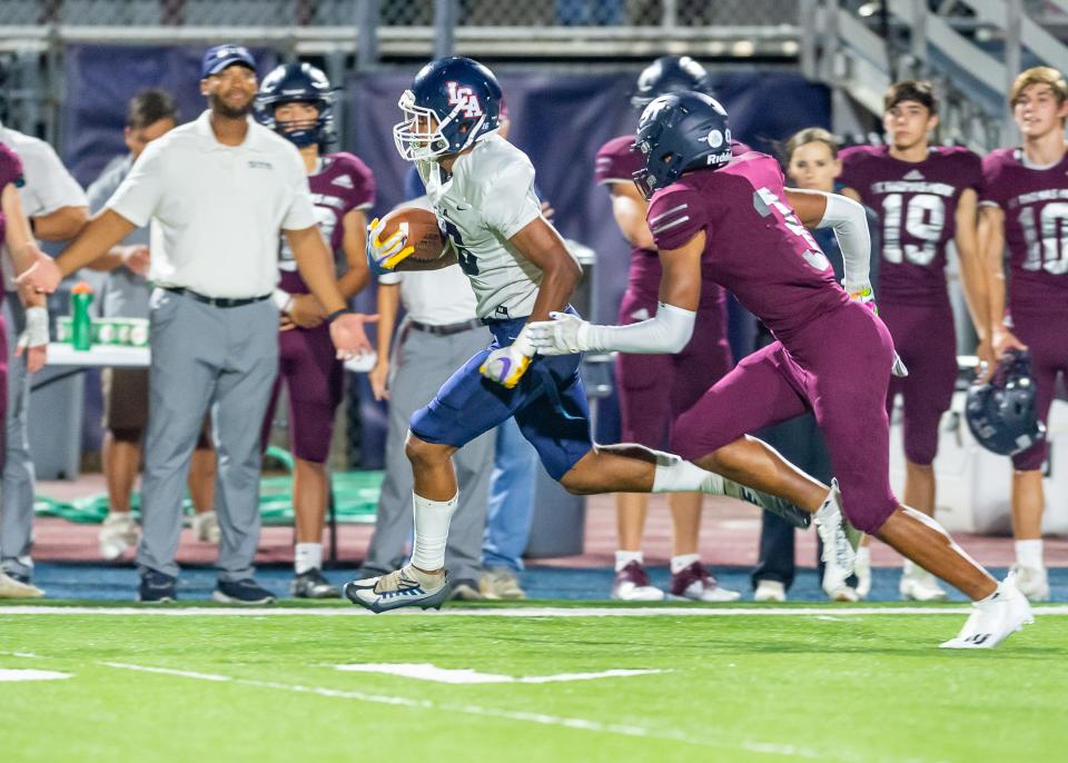 Trae Grogan runs the ball as STM takes on LCA football. Friday, Nov. 4, 2022.