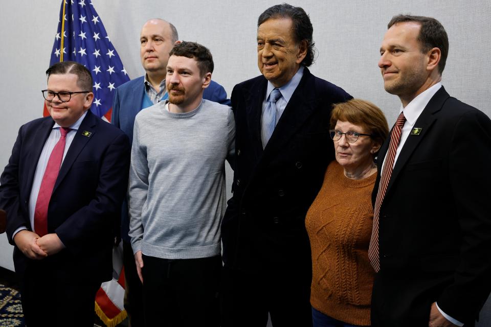 Jonathan Franks, Steve Menzies, Taylor Dudley, Bill Richardson, Dudley's mother, Shelley VanConant, and Mickey Bergman during a news conference one day after Dudley's release from prison in Kaliningrad, Russia.