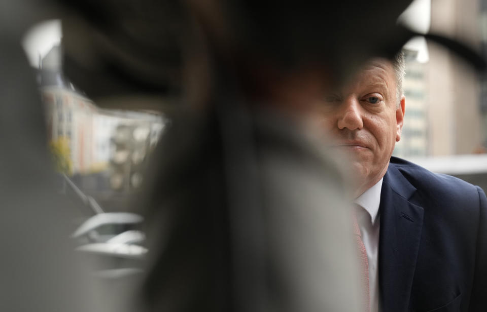 United Kingdom's Brexit negotiator Lord David Frost speaks with the media as he arrives for a lunch with European Commissioner for Inter-institutional Relations and Foresight Maros Sefcovic at EU headquarters in Brussels, Friday, Oct. 15, 2021. Brexit kicked into high gear again Friday, almost a year after a deal on a free trade agreement was supposed to have officially sealed the separation between the European Union and the United Kingdom. (AP Photo/Virginia Mayo)