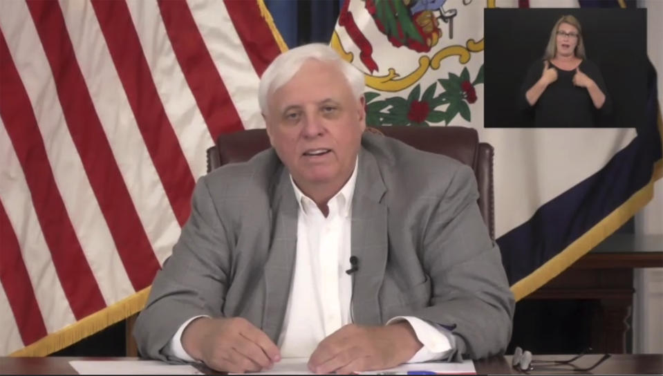 This image provided by West Virginia governors office, Gov. Jim Justice holds a news conference regarding the COVID-19 epidemic, Friday, May 29, 2020 in Charleston, W.Va. (West Virginia governors office via AP)