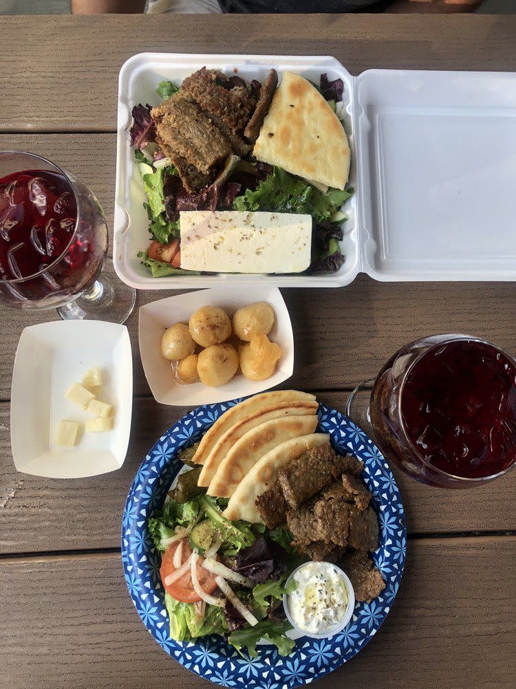 Lamb plate, salad, sangria, and beignets from Santorini Cafe Austin