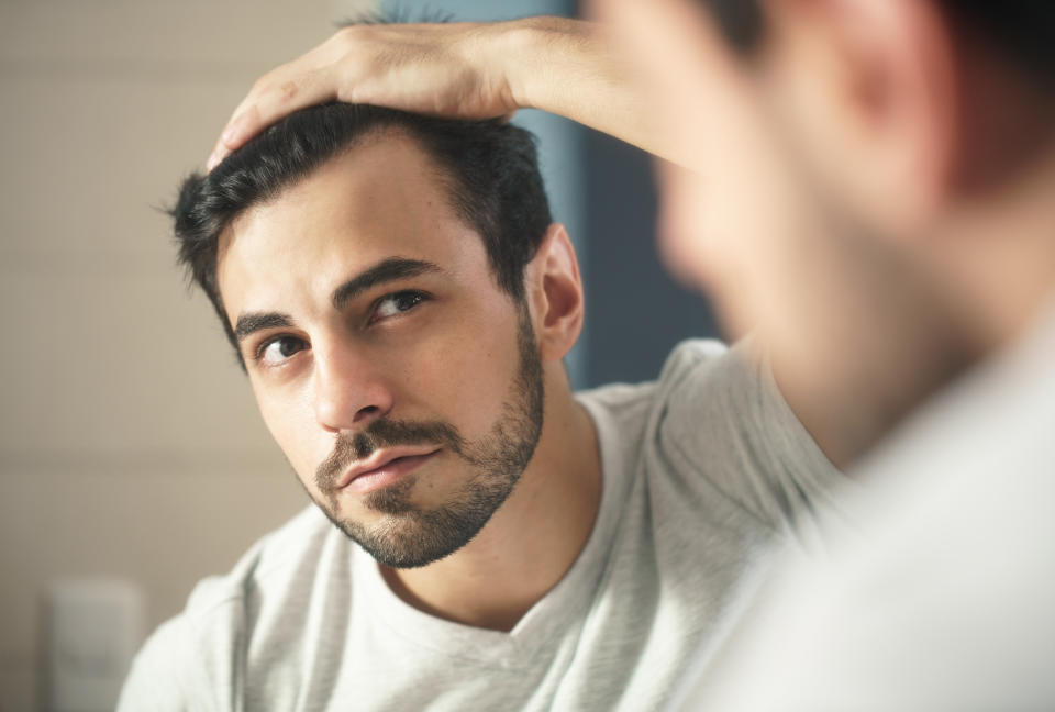 man looking in the mirror