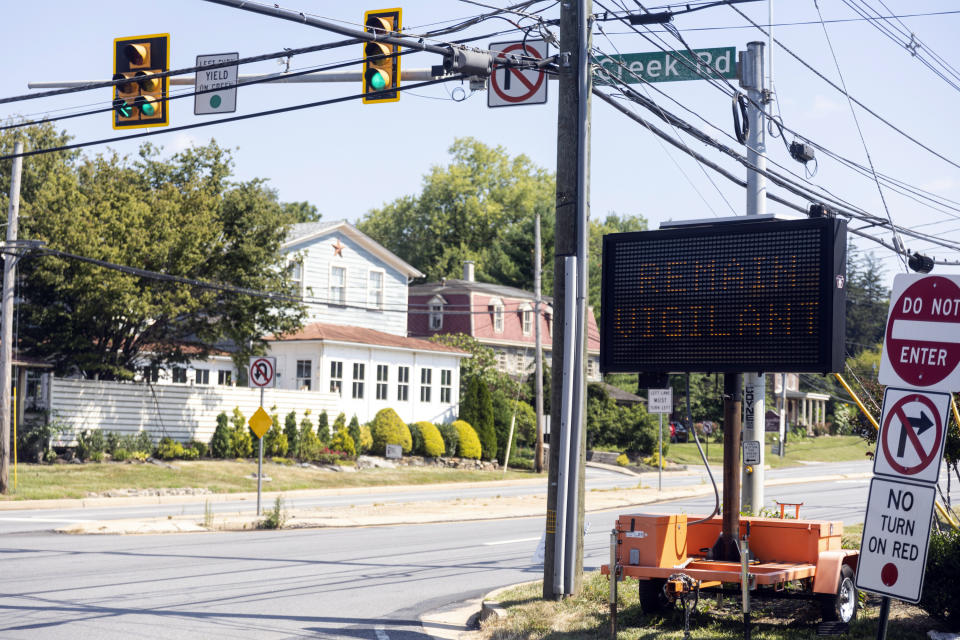 Signs warning locals and drivers passing through to remain vigilant as the manhunt continues for the escaped murderer Danelo Cavalcante in Chadds Ford, Pa., on Wednesday, Sept., 6, 2023. Cavalcante was able to escape a prison yard in suburban Pennsylvania last week by climbing up a wall and over razor wire, officials said at a news conference Wednesday. (Tyger Williams/The Philadelphia Inquirer via AP)