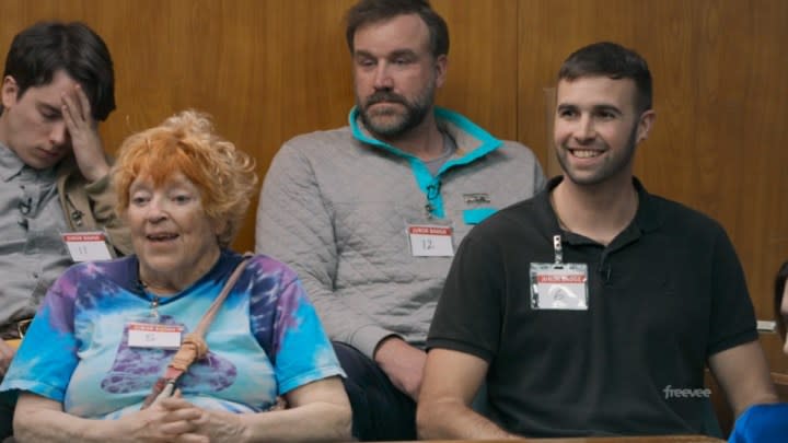 People sit in a jury box in Jury Duty.