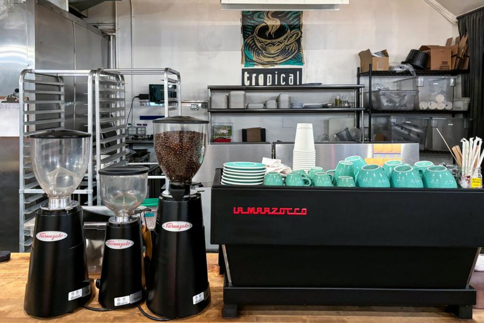 Espresso machine and grinders at Café Tropical.