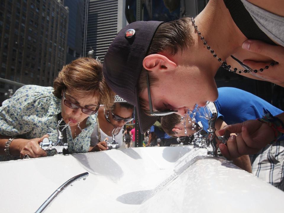 People Drinking Water Fountain Tap