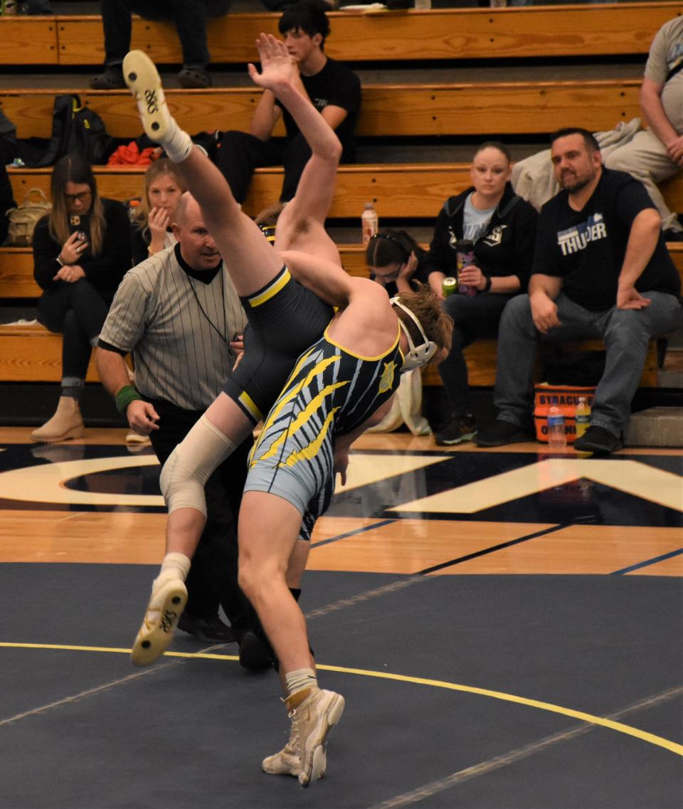 Central Valley Academy's Sixx Cook (right) throws Maxx Fesinger of West Genesee to the mat during a 152-pound match in the third round of competition at the Valley Duals Saturday in Ilion.