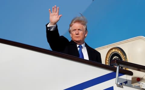 U.S. President Donald Trump boards Air Force One to depart for Vietnam from Beijing Airport  - Credit: Reuters