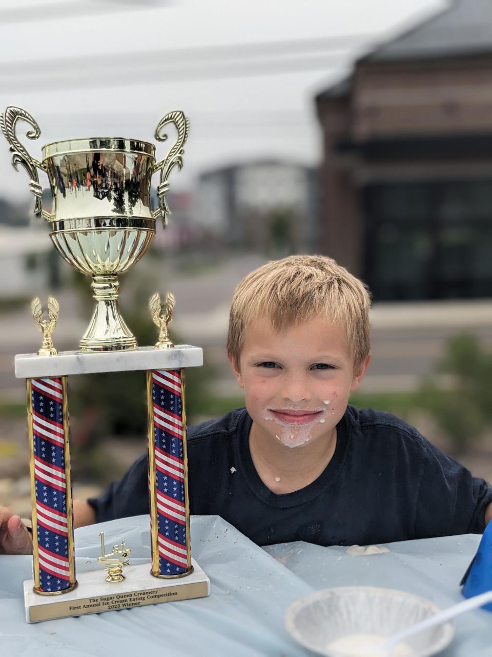 Collin Steel, winner of The Sugar Queen Creamery’s children’s ice cream eating contest, on June 29, 2023.