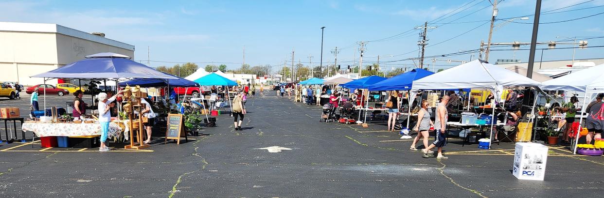 Guests shop at the first Evansville Farmers Market of 2022 on Saturday, April 23, 2022.