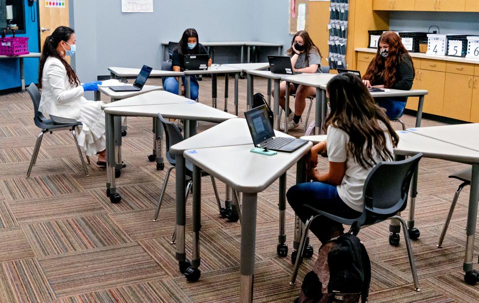 Students attend class with their laptops at Santa Fe South High School in Oklahoma City on Aug. 12, 2020.