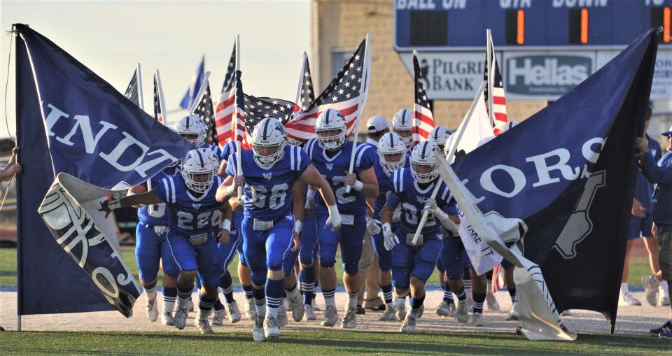 Windthorst runs on to the field before the start of their game against City View on Thursday, September 23, 2021, in Windthorst.