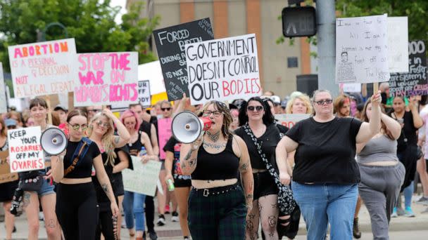 PHOTO: Audrey Umnus, center, leads a march along College Avenue to protest the overturning of Roe v. Wade, July 4, 2022, in Appleton, Wis. (Dan Powers/USA TODAY NETWORK)