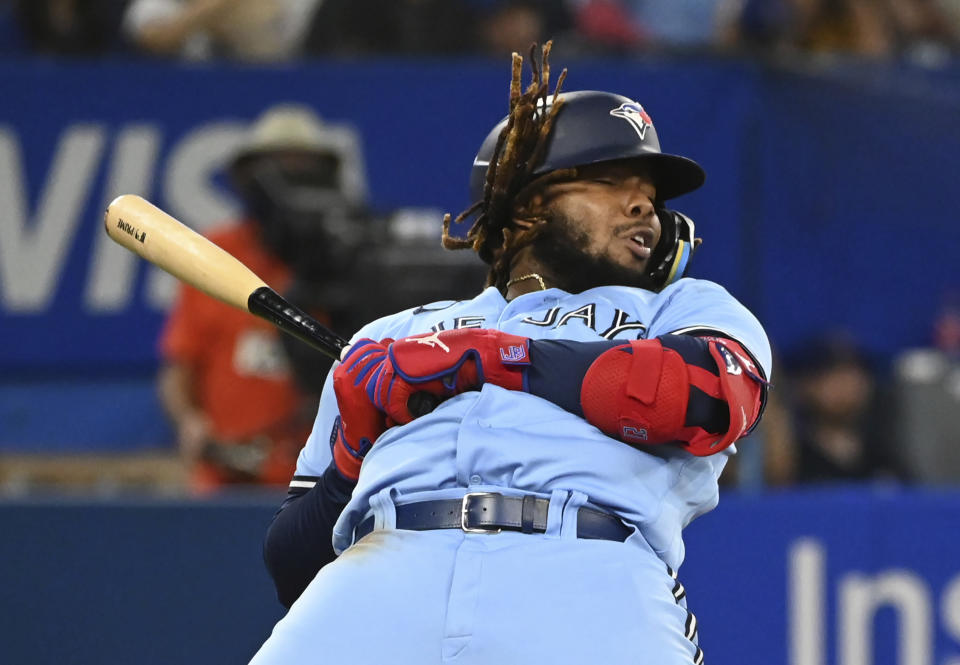 Toronto Blue Jays' Vladimir Guerrero Jr. reacts to a high inside pitch from Baltimore Orioles starting pitcher Dan Kremer in the third inning of a baseball game in Toronto on Sunday, Sept 18, 2022. (Jon Blacker/The Canadian Press via AP)