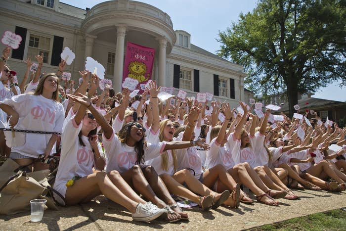 Sorority girls waving their arms and posing