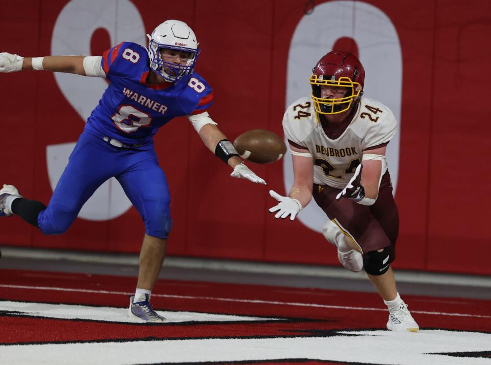 Deubrook Area's Conner Andrews hauls in a conversion pass against Warner's Hunter Cramer during the state Class 9A football championship on Thursday, Nov. 9, 2023 in Vermillion's DakotaDome. Warner won 76-54.