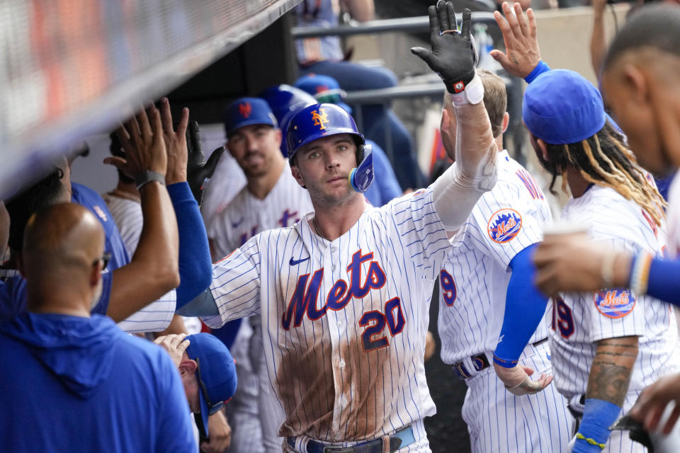 New York Mets' Pete Alonso celebrates in the dugout hitting a solo home run during the seventh inning of a baseball game against the Pittsburgh Pirates, Wednesday, Aug. 16, 2023, in New York. (AP Photo/Mary Altaffer)