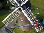 A homeowner has completed the ultimate lockdown DIY project at one of Britain's last fully-working windmills - after using a cherry picker to paint the sails by hand. Jeanette McGarry, 58, painstakingly spent three weeks touching up the paintwork on the gigantic five tonne sails as part of a refurbishment of historic Berkswell Windmill. The 70ft tall Grade II-listed building has been standing for nearly 200 years in the village of Balsall Common, West Mids., and was bought by Jeannette in 2005. She then spent £200,000 restoring the 19th century four-bladed tower mill to its former glory with the help of English Heritage after it fell into a state of disrepair.