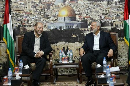 Senior Hamas leader Moussa Abu Marzouk (L) meets with the head of the Hamas government Ismail Haniyeh in Gaza City April 21, 2014. REUTERS/Mohammed Salem