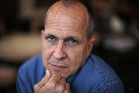 File photo of Australian broadcast journalist, Peter Greste, recently freed from prison in Egypt, poses for a portrait before giving a press conference at the Frontline club, London, February 19, 2015. REUTERS/Peter Nicholls