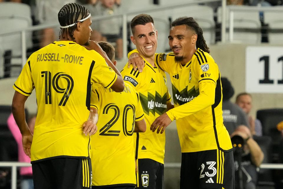 Aug 9, 2024; Columbus, OH, USA; Columbus Crew defender Mohamed Farsi (23) celebrates a goal by midfielder Dylan Chambost (7) during the second half of the Leagues Cup soccer match against Sporting Kansas City at Lower.com Field. The Crew won 4-0.