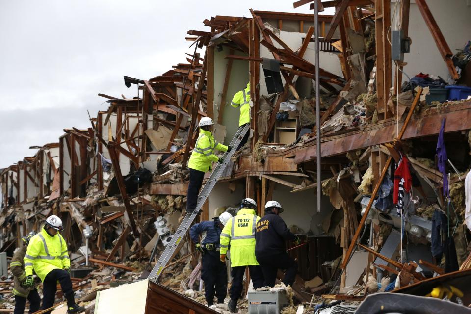 Firefighters conduct search and rescue of an apartment destroyed by an explosion at a fertilizer plant in West, Texas, Thursday, April 18, 2013.