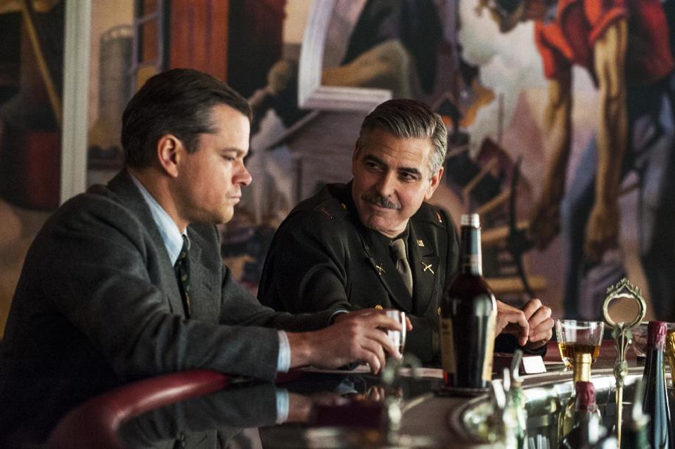 This film image released by Columbia Pictures shows Matt Damon, left, and George Clooney in "The Monuments Men." A spokesman for Sony Pictures said Wednesday, Oct. 23, 2013, that the film will now be released in the first quarter of next year, instead of its planned release date of Dec. 18. “Monuments Men,” which Clooney directed, co-wrote and stars in, had been expected to be a top Oscar contender. (AP Photo/Columbia Pictures - Sony, Claudette Barius)