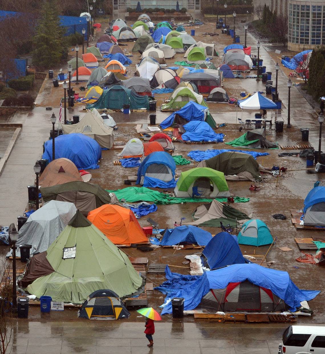 “Krzyzewskiville” is a quagmire of mud and broken tents Friday March 7, 2014 the day before the final game of the regular season. Students who camp out next to Cameron Indoor Stadium for the UNC- Duke showdown are given “amnesty” when there is bad weather or cold temperatures.