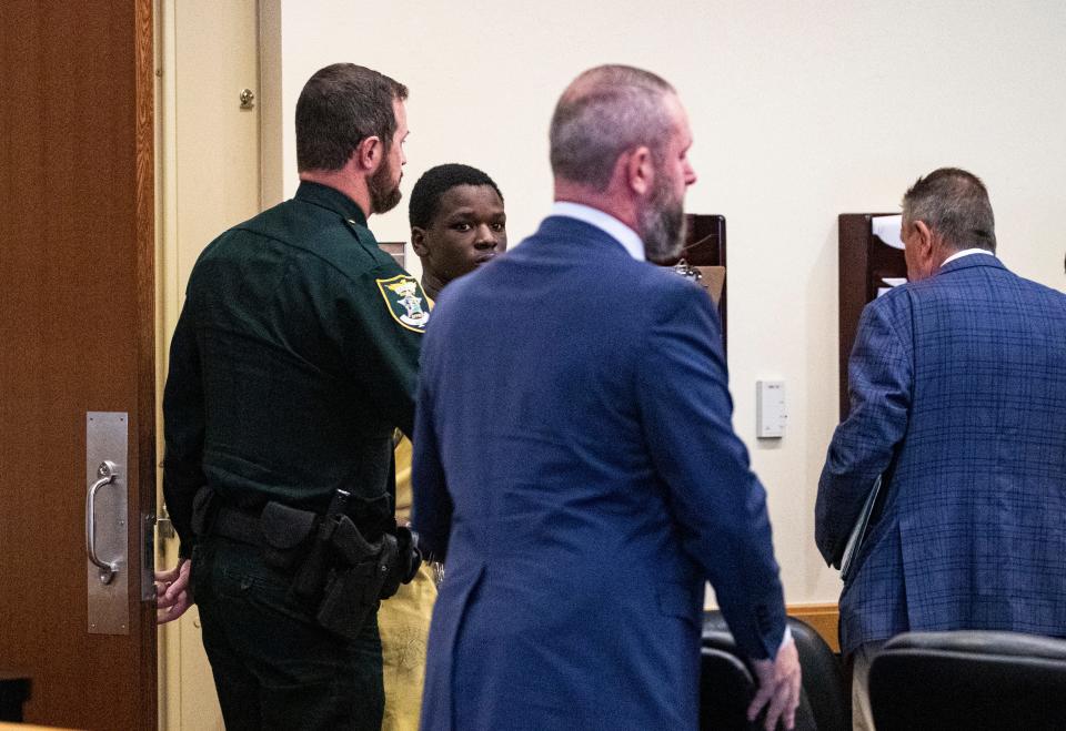 Christopher Horne, 16, enters a Lee County courtroom during a pretrial detention motion on Thursday, May 9, 2024. He has been arrested in connection with the murder of Kayla Rincon-Miller, 15,. Lee County Judge Nicholas Thompson ruled that he will be held without bond after testimony from a Cape Coral detective.