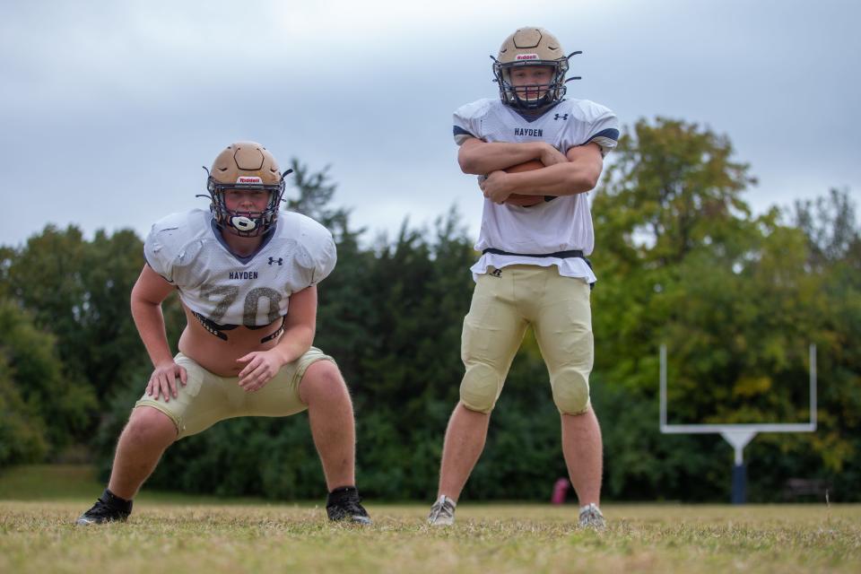 Offensive and defensive lineman, and Notre Dame commit, Joe Otting (left) and running back and linebacker JC Cummings (right) return as two key pieces on both sides of the ball for Hayden.