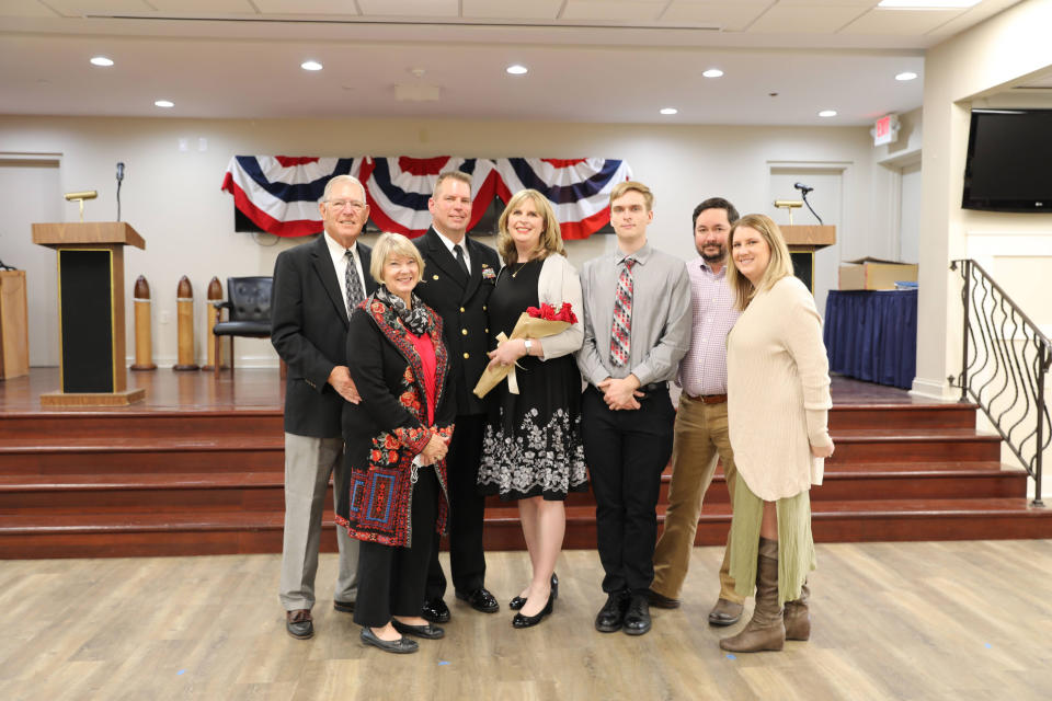 Heidi Evans with her husband and family at a recent promotion ceremony. (Courtesy Heidi Evans)