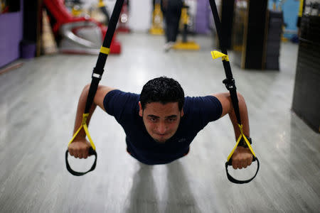 A Palestinian man exercises in a gym in Gaza City. REUTERS/Suhaib Salem