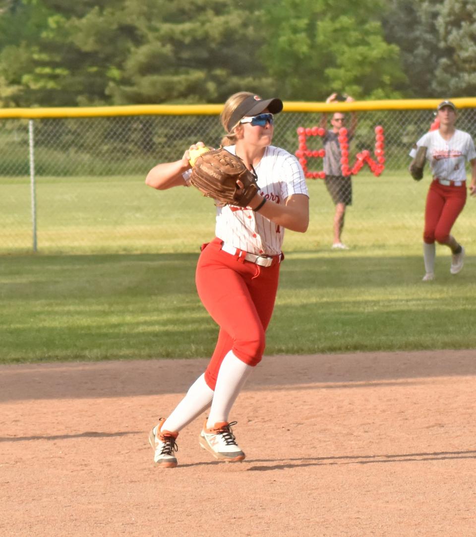 Coldwater's Rylie VanAken readies to throw out a Marshall runner at first Tuesday night