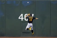 Pittsburgh Pirates' Bryan Reynolds (10) can't field a double hit by Arizona Diamondbacks' Christian Walker during the fourth inning of a baseball game, Monday, Aug. 8, 2022, in Phoenix. (AP Photo/Matt York)