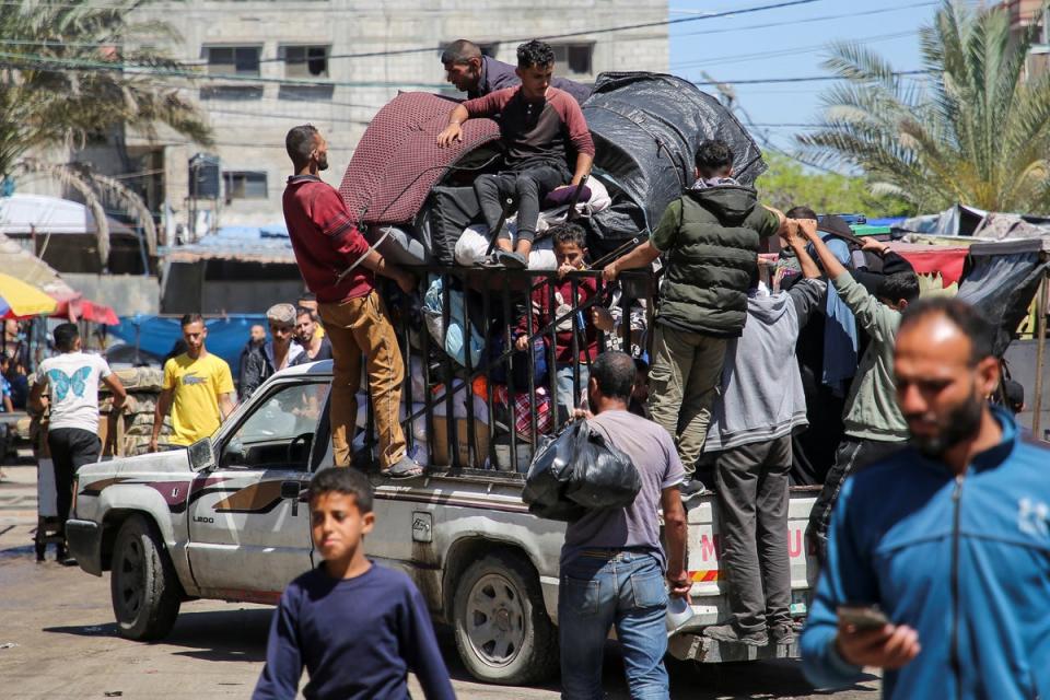 Palestinians flee Rafah on Wednesday (Hatem Khaled/Reuters)