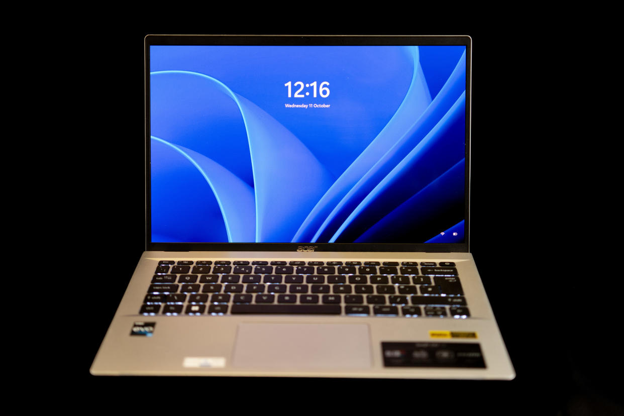  An Acer Swift Go 14 OLED laptop on a black background. 