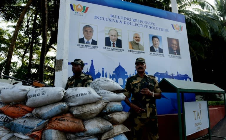 Security personnel stand guard outside the Taj Exocita hotel, the venue for the BRICS Summit in Goa, on October 15, 2016