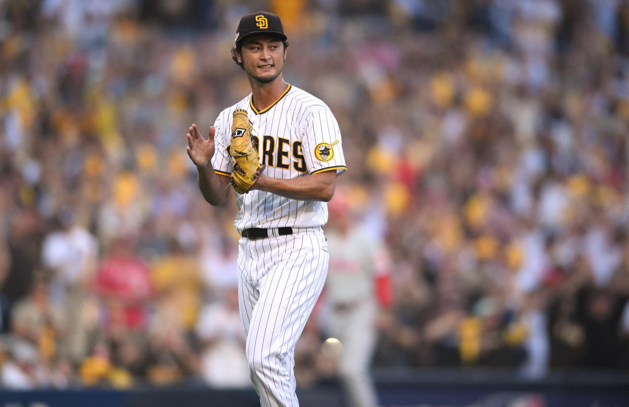 Oct 18, 2022; San Diego, California, USA; San Diego Padres starting pitcher Yu Darvish (11) reacts after an out during the first inning of game one of the NLCS for the 2022 MLB Playoffs against the Philadelphia Phillies at Petco Park. Mandatory Credit: Orlando Ramirez-USA TODAY Sports