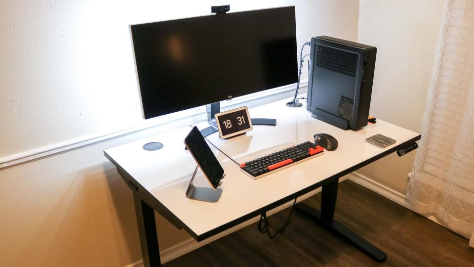 The Uplift V2 standing desk with grommets at the rear