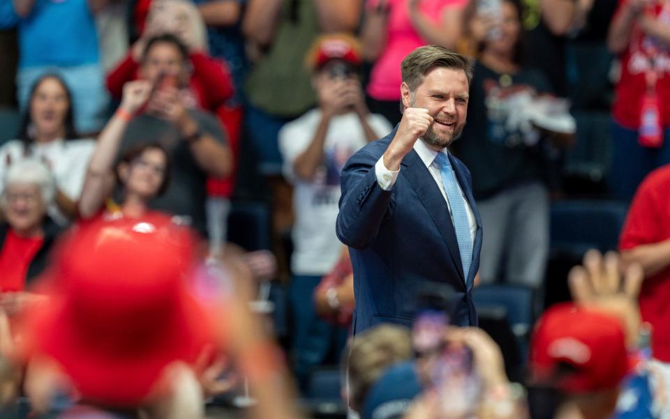 Amid a sea of supporters, vice-presidential nominee JD Vance takes the stage during a rally at the Van Andel Arena in Grand Rapids on Saturday, July 20, 2024.