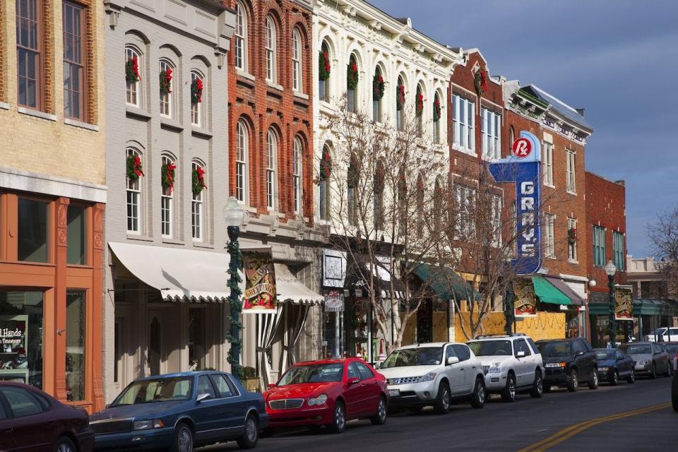 Historic Main Street with Red Brick Storefronts, parked cars and Grays Pharmacy in Franklin, Tennessee, a suburb south of Nashville, Williamson County, Tenn.