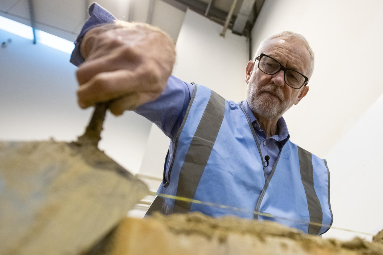 NOTTINGHAM, ENGLAND - NOVEMBER 25: Labour leader Jeremy Corbyn lays a brick during a visit to West Nottinghamshire College Construction Centre on November 25, 2019 in Nottingham, England. A day after Prime Minister Boris Johnson launched the Conservative manifesto, Jeremy Corbyn is expected to announce Labour's housing policy.  (Photo by Leon Neal/Getty Images)