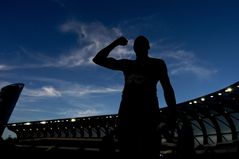 Grant Holloway celebrates after winning the men's 110-meter hurdles final during the U.S. Track and Field Olympic Team Trials Friday, June 28, 2024, in Eugene, Ore. (AP Photo/Charlie Neibergall)