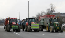 French farmers drive their tractors on the A7 highway to protest changes in underprivileged farm area’s mapping and against Mercosur talks, in PIerre-Benite near Lyon, France, February 21, 2018. REUTERS/Emmanuel Foudrot