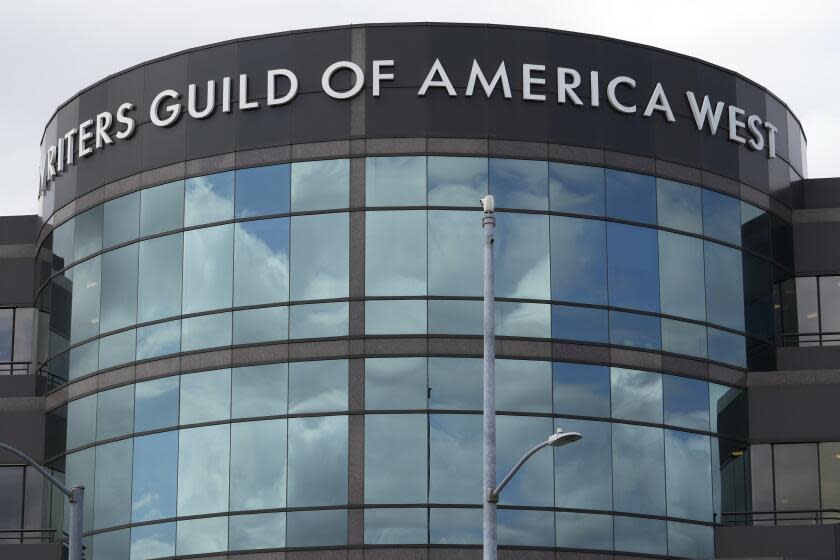 The entrance to the Writers Guild of America West building — a large, round building with lots of windows